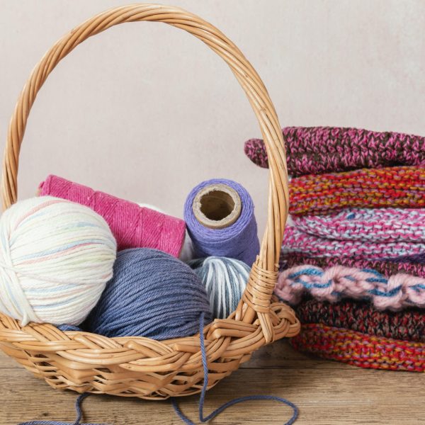 basket-with-wool-knitting-needles-scaled