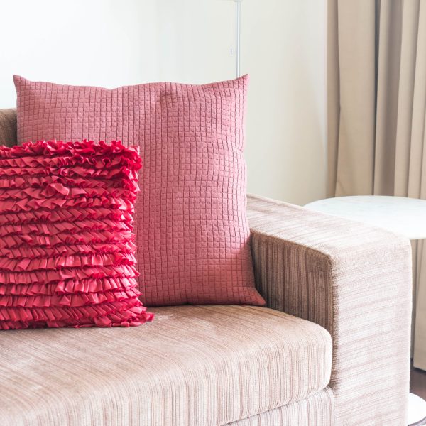 Beautiful pillow on sofa decoration in living room interior