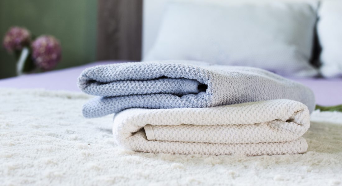 decoration-with-soft-towels-bed-scaled