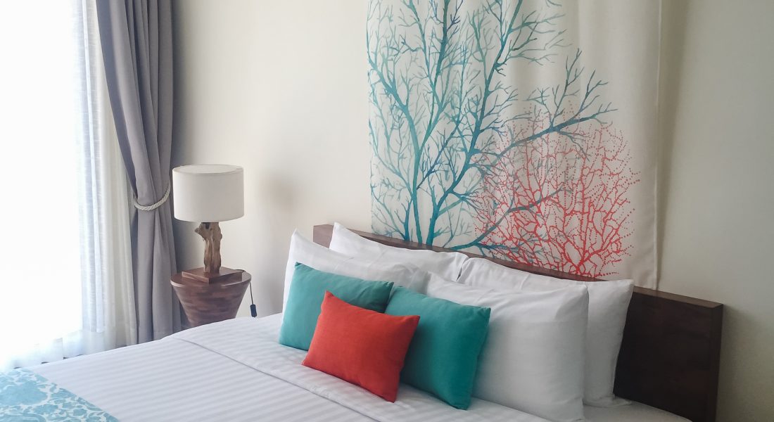 Clean hotel room with wooden bunk beds. Vintage effect style pictures.